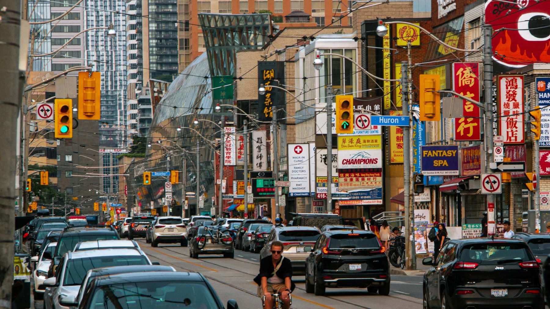 busy street with lots of car traffic in downtown Toronto, ON