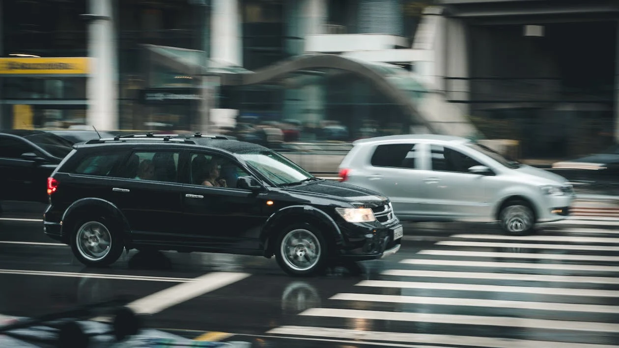 cars driving through intersection