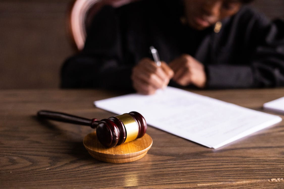 A gavel with on a desk of a court judge