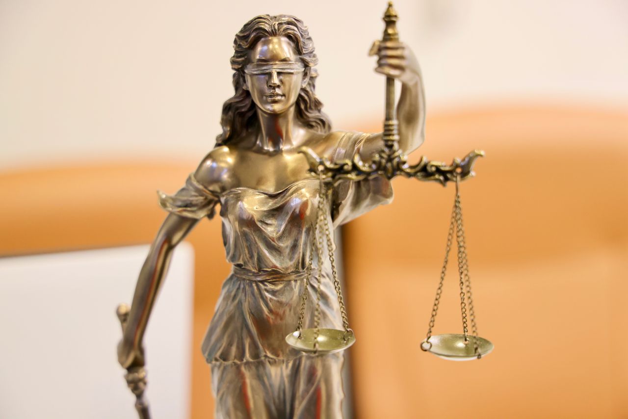 Close-up of lady justice statue with scales