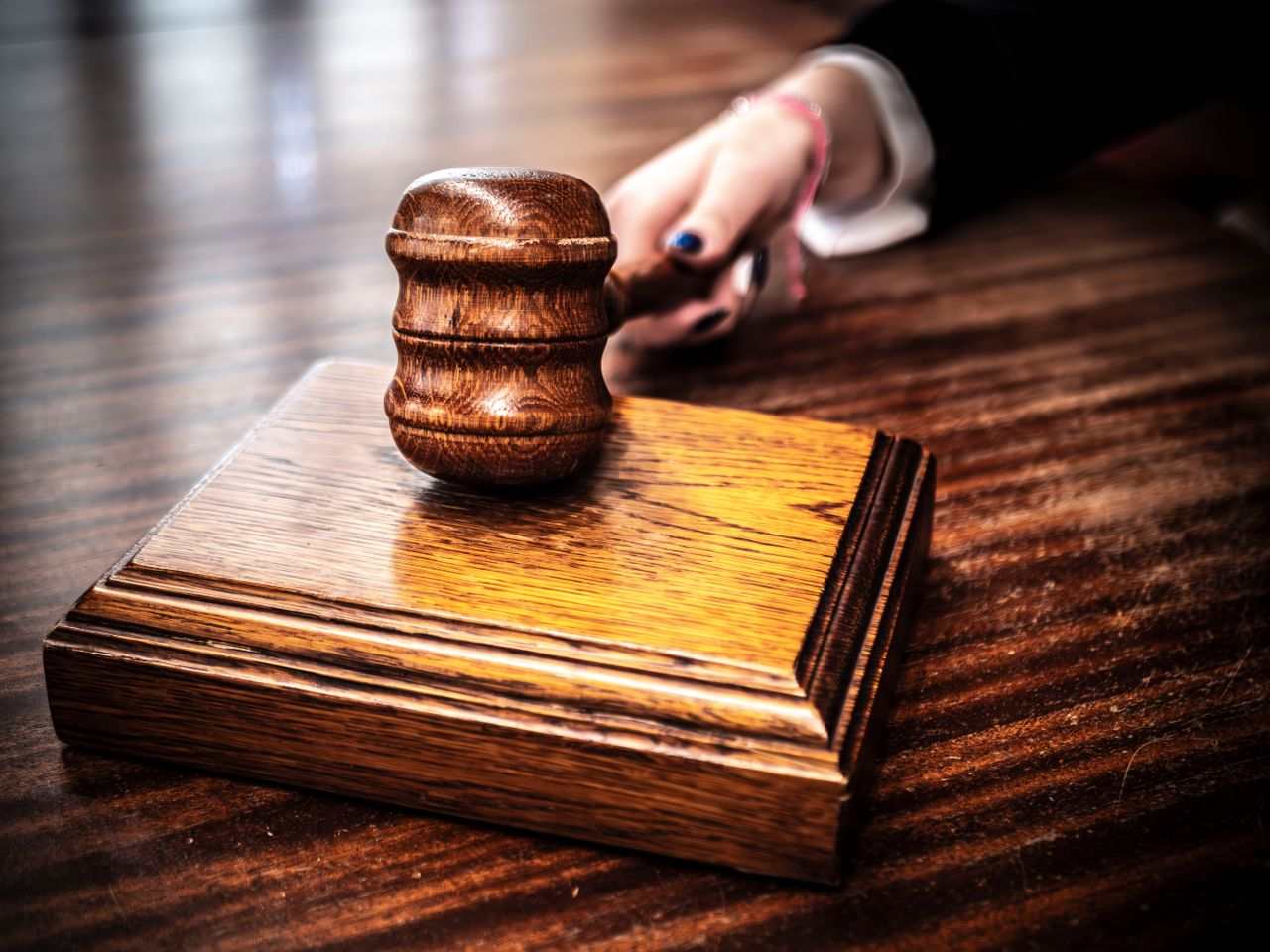 Post5 Closeup of a judge’s gavel on a wooden table